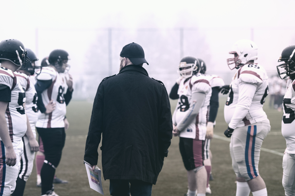 coach with young players