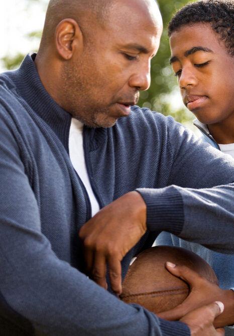 Father,And,Son,Playing,Football,And,Spending,Time,Together.
